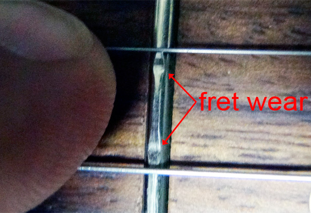 guitar string fret wear