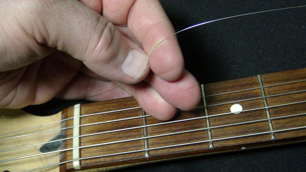 Leave one to three fingers' worth of slack in the string